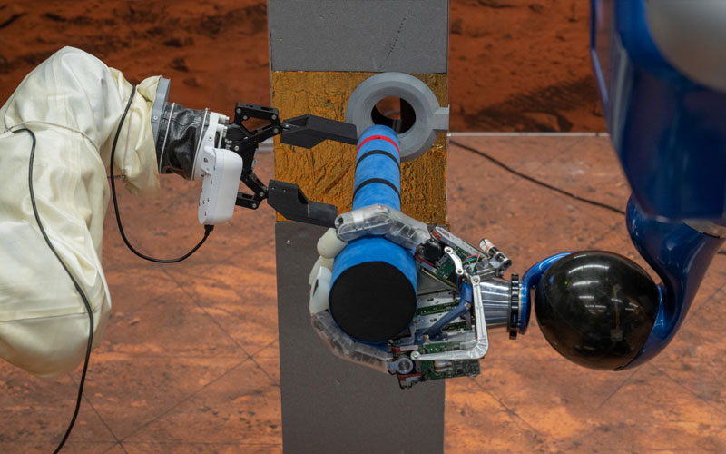 DLR's Bert and Rollin' Justin robots work together with and ESA's Interact Rover.